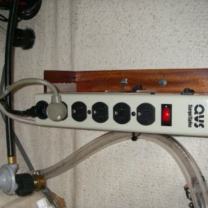 Media 'Step 2, wired power strip to the backside of inlet plug(upper left). Now I have a 15 amp resettable breaker, and an on/off indicator switch/light. My dock outlet is already GFCI.' in album 'Step one, power thru the bulkhead.No it's not on fire,just the Glow light telling you it's  ALIVE !'
