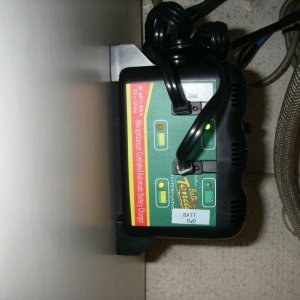 Media 'Battery tender dual charger, direct wired to A and B batteries.Mounted under sink left wall behind seat' in album 'Step one, power thru the bulkhead.No it's not on fire,just the Glow light telling you it's  ALIVE !'