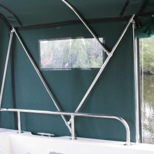 Media 'Self supporting frame for Bimini. Quick release for travel--and there will be a second aft position on the swim step/bracket for a lower trailering position' in album 'In driveway'