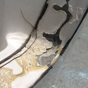 Initial cuts on stb side of transom.  Note the crack which starts in the spash well and then goes down the top of the transom.