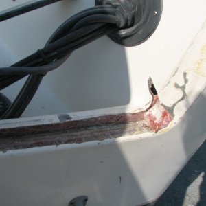 Final clean out of transom on stb.  Note the hole all of the way thru the splash pan--This is where the cracks are developing in the side of the transoms, and the load is transfered there inside of to the side of the hull as is proper.