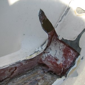 Hole in filler on stb side of transom--only a layer of roving taking the load of the thrust of the engine, with lots of filler/polyester resin