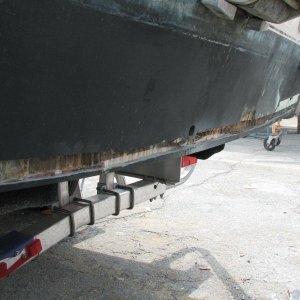 cut along the entire bottom of transom to expose the balsa core and dry it before filling this void with glass and relaminating the transom