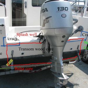 Photo outlining the part of the transom backed with wood.  Cracks in to the splash well area from the top of the transom. Areas or repair deliniated in masking tape.