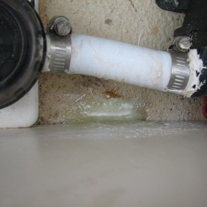 Screw (rusted, with damp core) and bracket removed, damp core removed and dryed, filled with epoxy and fillet, then glass to bond floor to step face, eliminating any screws into the core