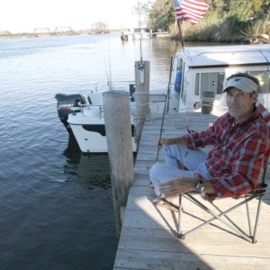 John fishes on the river
