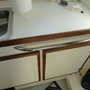 railing in front of galley, grab and towel