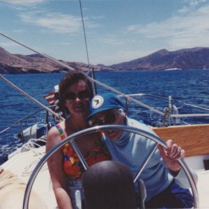 Marie and my mother at age 87 at the helm of \"Thataway\"