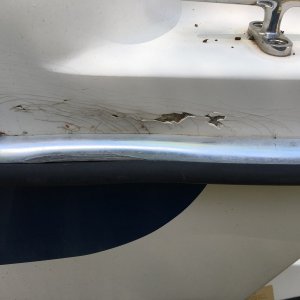 ding port quarter slight bend rub rail