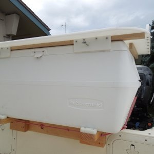 Bungee cord shown here front and back, I now use cam straps to hold it in place.