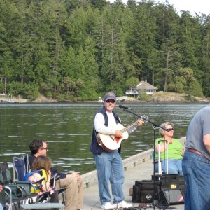 Media 'Jim  (Wild Blue) entertaining at the pot luck' in album 'at Sidney Spit marine park BC,  how much do you need?'