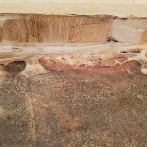 Along the sidewall I ran into filler where the balsa core met the wall. You can see a lot of air pockets and thick epoxy.  How smooth does this need to get?
