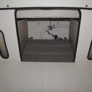 Wasted space before.  Keeps items off of bilge well. 2/14/11