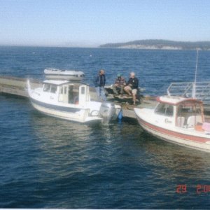 On the dock at Sequim: Joe, Jon and Fred. In the water, R-MATEY & LITTLE BUDDY.