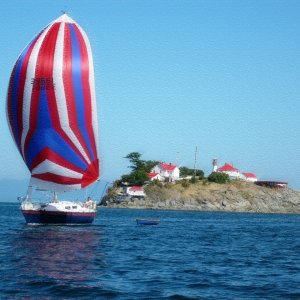 Sailboat at Chrome Island Lighthouse, B.C.