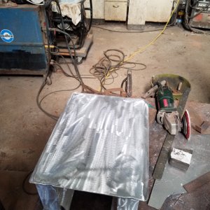 Fabricating an aluminum mount for the Clark pump.