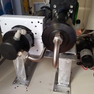The aluminum shelf elevates the Ckark pump, it engages lugs at the rear so it easily slides out for maintenance.