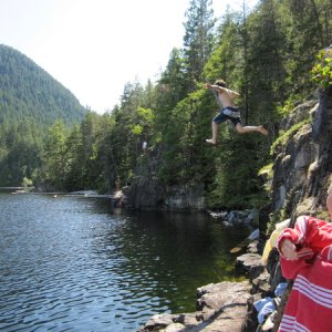 Jordan jumping off into Unwin Lake