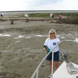 Climbing off the bow to do some bay clean up