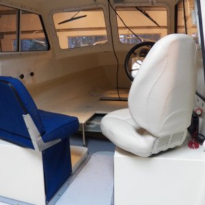 Media 'The width of the original seat hit the throttle at the bottom and the back of the seat hit the cabin side.  Also, although the original seat was shorter, the back thickness and angle interfered with the wheel when turned 180, requiring the seat to be more upright if turned around.' in album 'The original seats were Sunbrella over flat foam over a piece of plywood.  After a few years, they feel like Sunbrella over plywood.  The widest part of the original seats was at the aluminum hinge right at the bottom, causing my pilot seat to interfere with the throttle when I rotated the seat.'