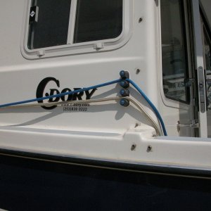 Media 'Sea Angel Port Cam Cleats- 1/2" gold 25' braid bow line thru bottom cam cleat, 3/8" blue 25' breast line through top cam cleat' in album 'Sea Angel Dock Line System with HARKEN Cam-Cleats with color cam caps added. All dock lines are 25'long.'