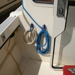 Media 'Sea Angel Port side Shockcord Line Hangers -for 1/2" gold bow  and 3/8" blue breast lines' in album 'Sea Angel Dock Line System with HARKEN Cam-Cleats with color cam caps added. All dock lines are 25'long.'