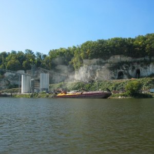 Corn barge being loaded from elevator, note dust