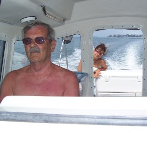Pap at the helm...first mate (Nancy) in background