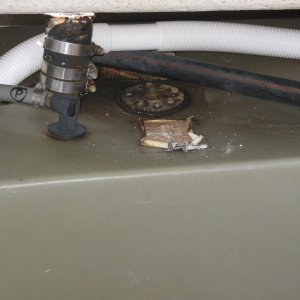 Port tank with concaved top...holds water around fuel gauge gasket