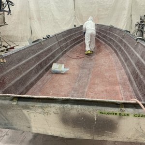 This is the 23 hull after all of the fiberglass has been ground down so that gel coat can be applied and small parts can be assembled.