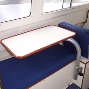 The table can be swung over the bench seat and be used to prepare meals and leave room for two people to pass by each other.