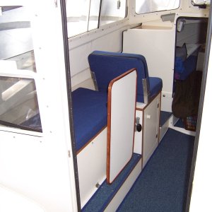 Table can also be stowed in a vertical position allowing one person to sit on bench seat. Access to storage lockers is possible in this position also.