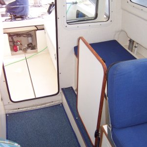 Another shot of table stowed in vertical position allowing free fore and aft movement.