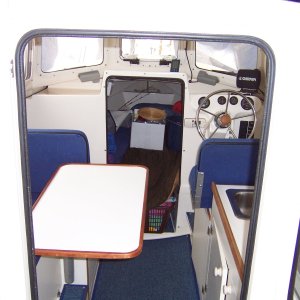 One mre picture showing the table in the dining position and room to slip by it.