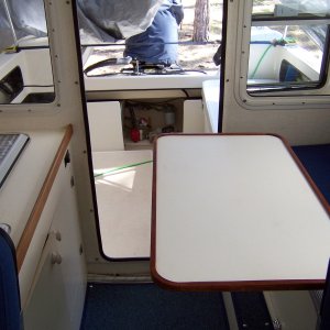 I did not include a picture, but the table and pedestal can be removed and laid on the v-berth for complete out of the way day time storage.