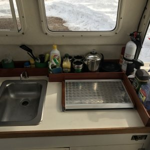 Wood storage racks on galley counter top