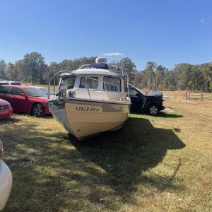 a month in a wet field waiting for the adjuster to make a call - he couldn\'t inspect it without lifting... so they totaled the boat