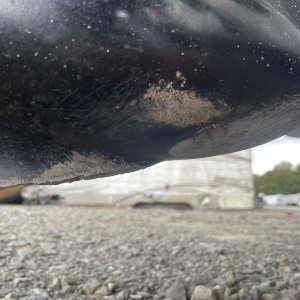 broken fin and sanded drain plug screwhead