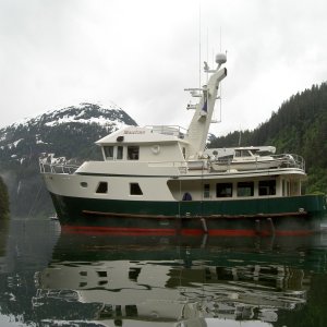 a c- dory riding a yacht