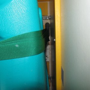 I had secured Weld Mount footman loops to the cabin sole to strap the "real" tank down to; using them now for holding the jugs in place with the green straps.