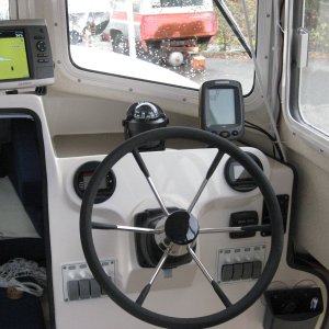 Kerri On's  Garmin 541 Gps , Ritchie compass,Humminbird 160 sounder, Seastar tilt helm, Yamaha twin guage pack Bennett tabs, stock panel