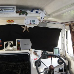 Media 'Blackout curtains and dash layout.   You can just make out "Gord" our guide frog on the electronics shelf. One needs a pet and he works cheap. Also my micronesian star chart from my buddy Winston for good navigation luck' in album 'Kerri On first look Oct 2010, one of the first 2011's'