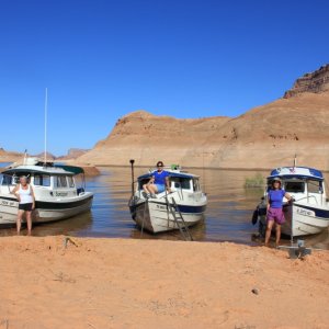 The Admirals next to their boats.