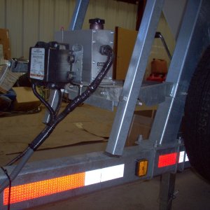 (Cygnet) Moved the electric/hydraulic actuator up 10 1/2" for easier launching and loading