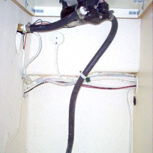 Relocated the wash down pump, up under the cabinet top. Rear port side cabinet.