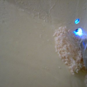Drilling the drain hole, low enough to actually drain.