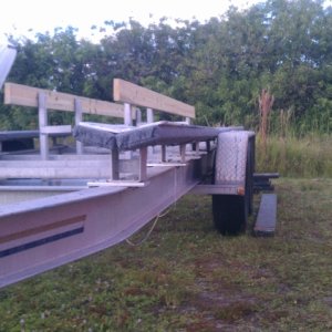 Media 'To get the bunk high enough to clean the fender well and to help support the brackets in the front as they hang over the frame I used 1/2" alum shims.' in album '2000 Float On Cat Trailer'