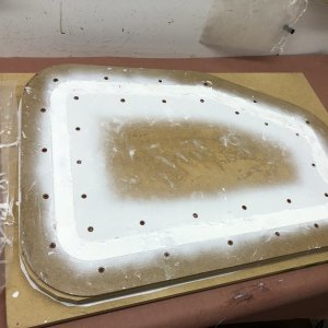 Media 'Mold has been filled with fiberglass and West System 105 epoxy resin with white color additive. I waited three days then I sanded the excess cured resin from the top of the mold before disasssembling the mold and releasing the part. I was nervous about it releasing but it easily popped free.' in album 'I'm modifying each lazarette to hold a 5 gal. horizontal propane tank. Starboard tank for heater and stove. Port tank for BBQ. Problem: Existing lockers are too small. Solution: Make them bigger. This means not just the interior of the locker, but the opening as well. I also wanted the opening to match the profile of the original hatch opening so, although it will look a little different from the original, it won't look like it wasn't part of the original design. I started with a mockup of the enlarged interior to make sure everything needed to meet ABYC guidelines will fit inside.'