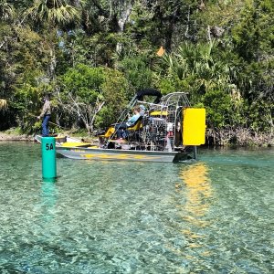 Media 'Airboat with kid spearfishing on front in Silver Glen Springs' in album 'Heading up the Norris Dead River before the gathering to catch up wtih a group already at DeLeon Springs. (For Pancakes the next morning!)'