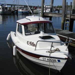 Media 'C-Dory 16 Cruiser tied to floating dock' in album 'C-Dory 16 Cruiser with Suzuki 40HP 4-Stroke and Yamaha 4HP 4-Stroke Kicker -- Stern view showing security cable placement for kicker'
